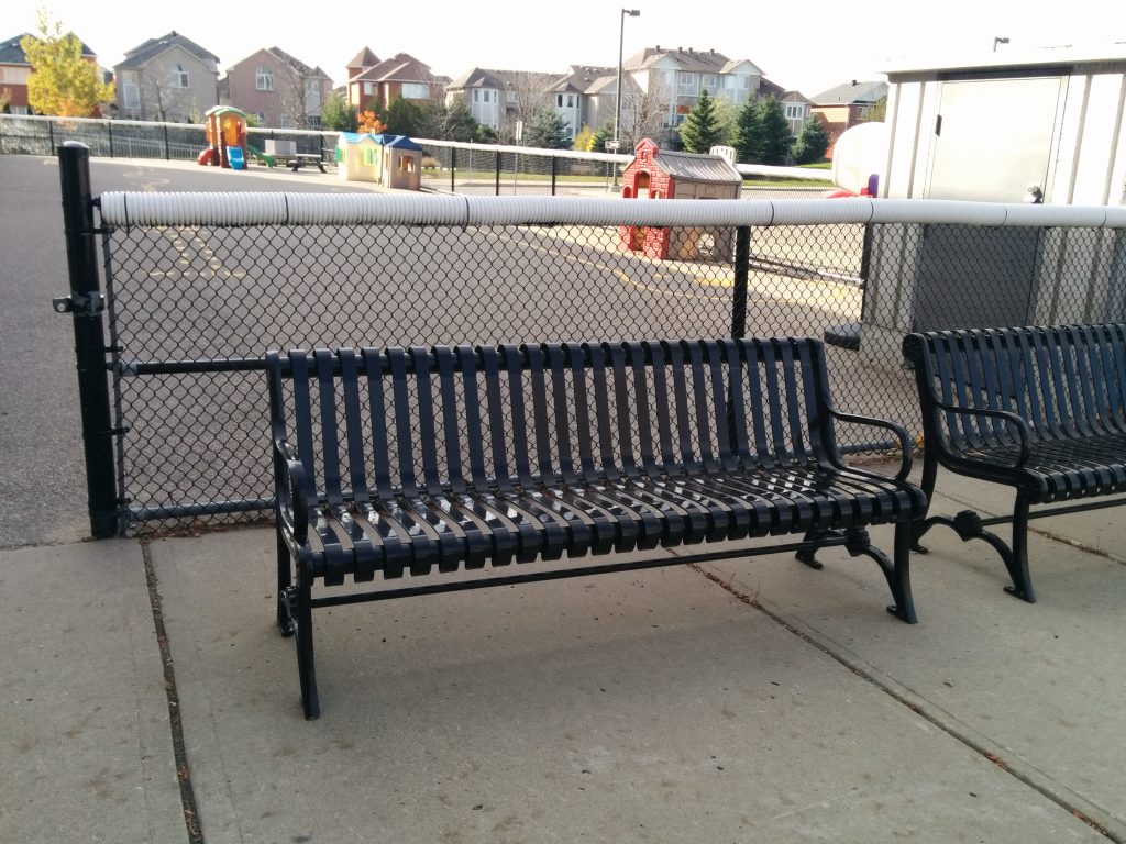 Commercial Outdoor Metal Bench SPB-301 glossy black in a school beside playground